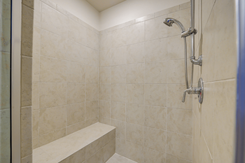 Rainfall showers with handheld shower heads